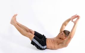 man on floor performing the banana exercise