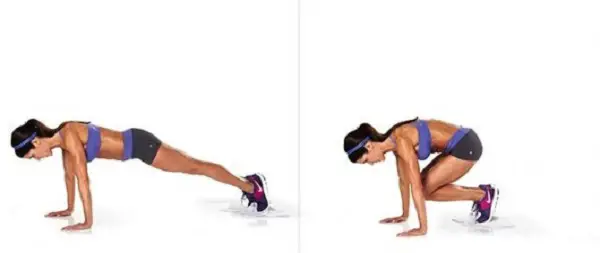 woman showing how to do the Plank Jump Ins exercise https://get-strong.fit/Plank-Jump-Ins-How-To-Exercise-Guide/Exercises