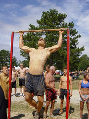 Man performing pull-ups in the park