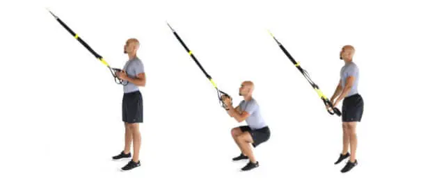 man showing how to perform the trx jump squat
